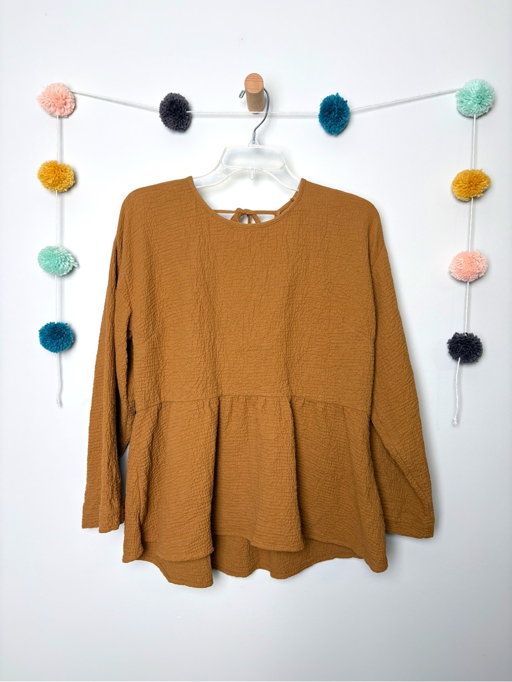 Lightspun Button-Back Peplum Top in Gold